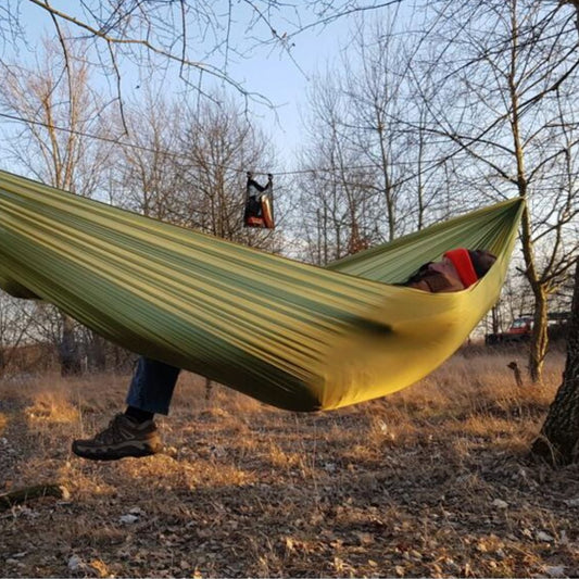 Bushmen Ultralight Hammock (Green) set up in woods