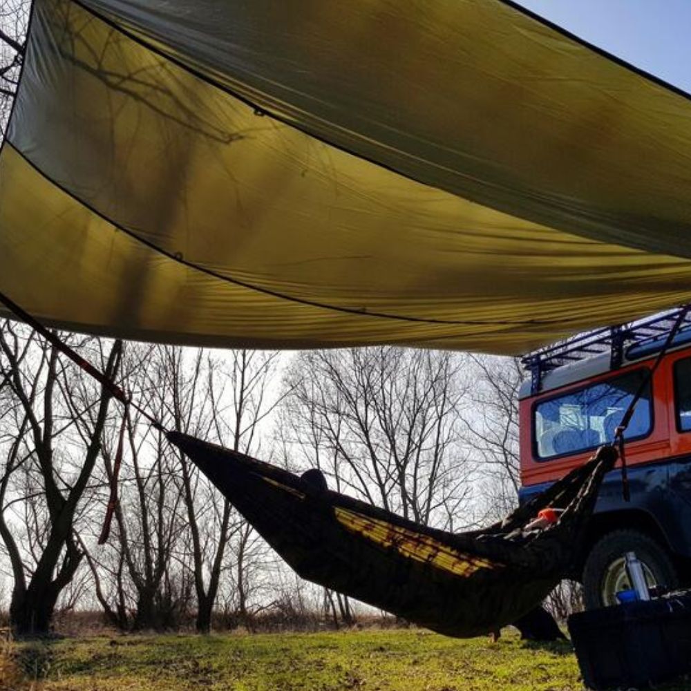 Bushmen 4×4m Thermo Tarp (Olive) attached to car