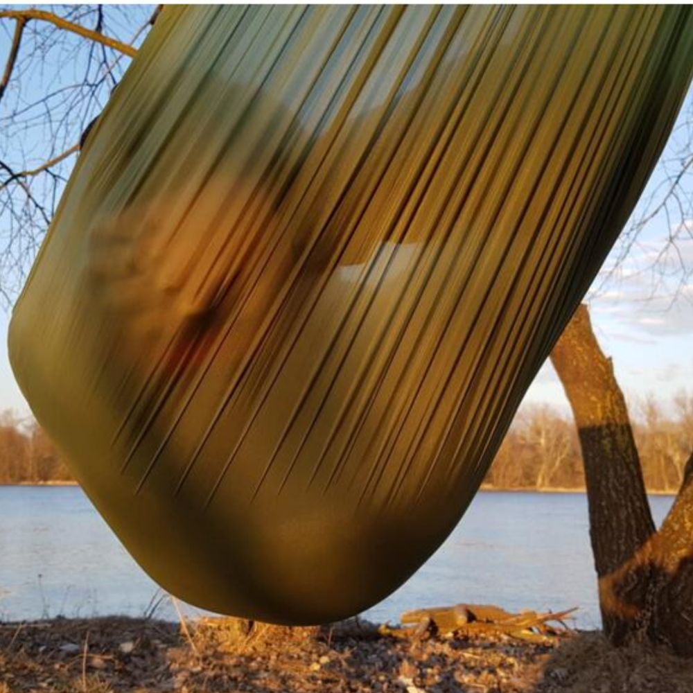 Bushmen Ultralight Hammock (Green) with person inside