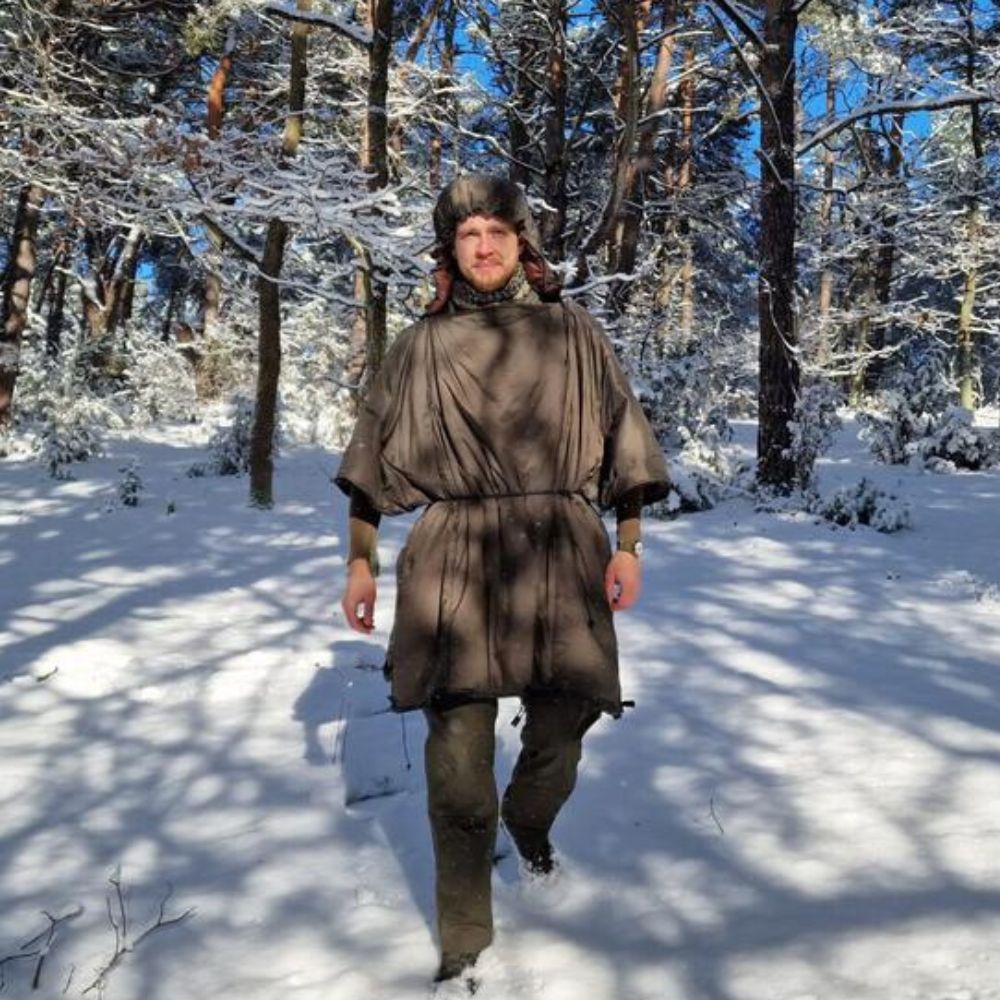 Bushmen Walker 1L Sleeping Bag (Olive) being used in the snow