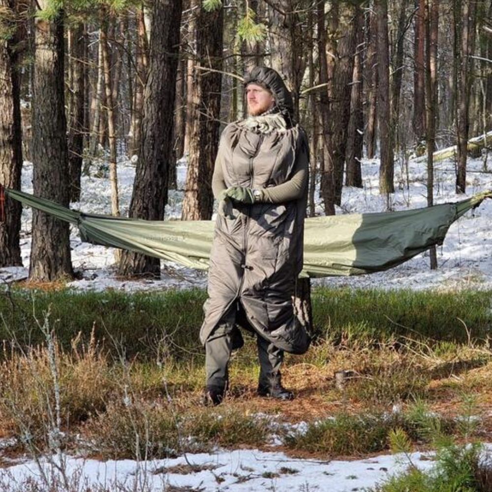 Bushmen Walker 1L Sleeping Bag (Olive) being used in snowy forest