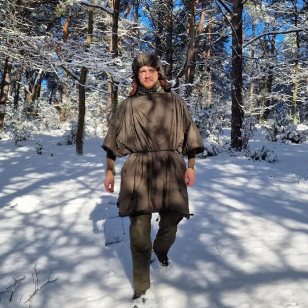 Bushmen Walker 3L Sleeping Bag (Olive) being worn in the snow