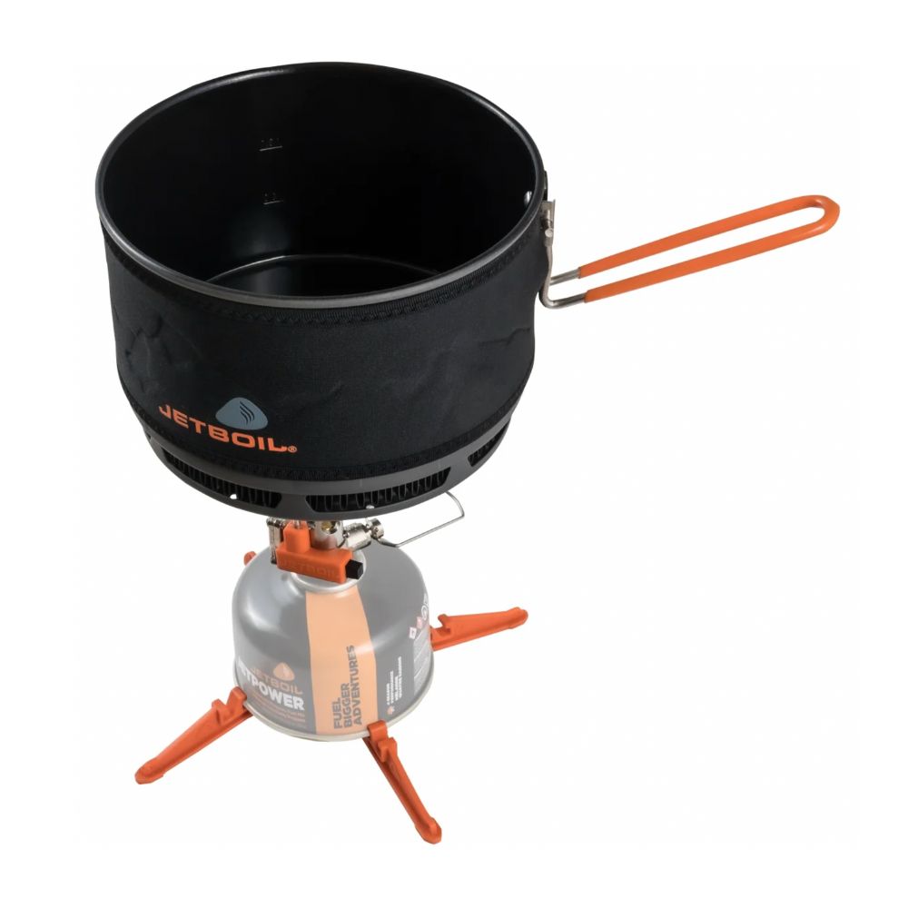 Jetboil stove system with black container and orange accents on a white background