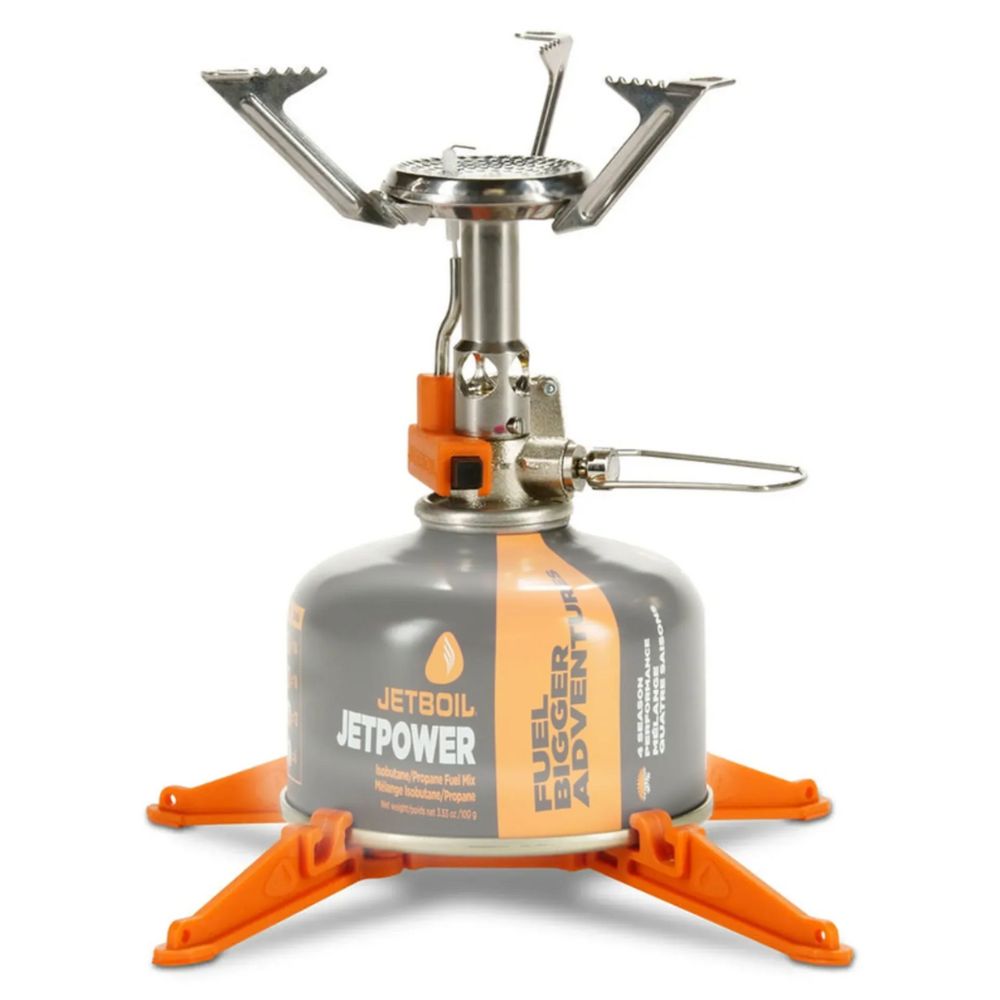 Camping stove with fuel canister on a white background