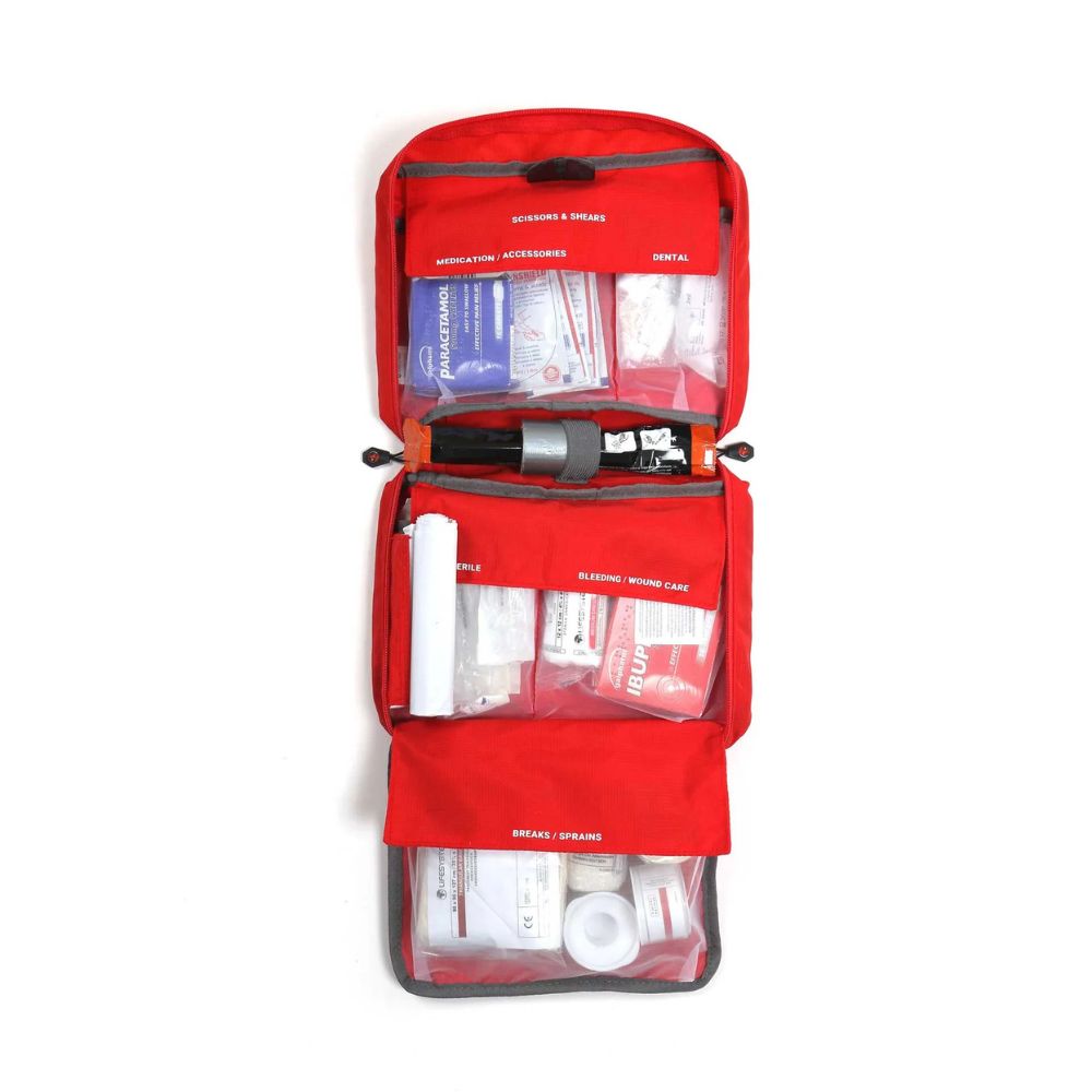 Lifesystems Mountain Leader Pro First Aid Kit with various supplies on a white background