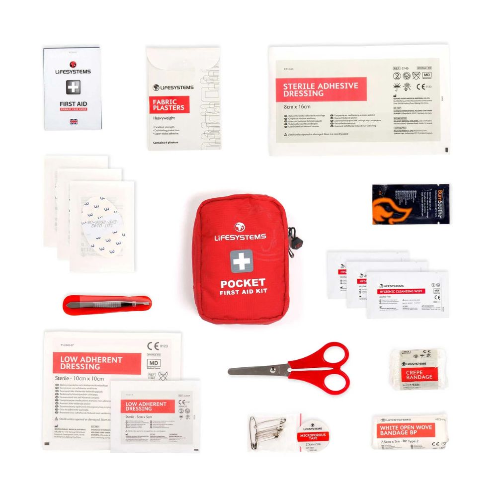 Collection of first aid items including a red Lifesystems pocket first aid kit on a white background.