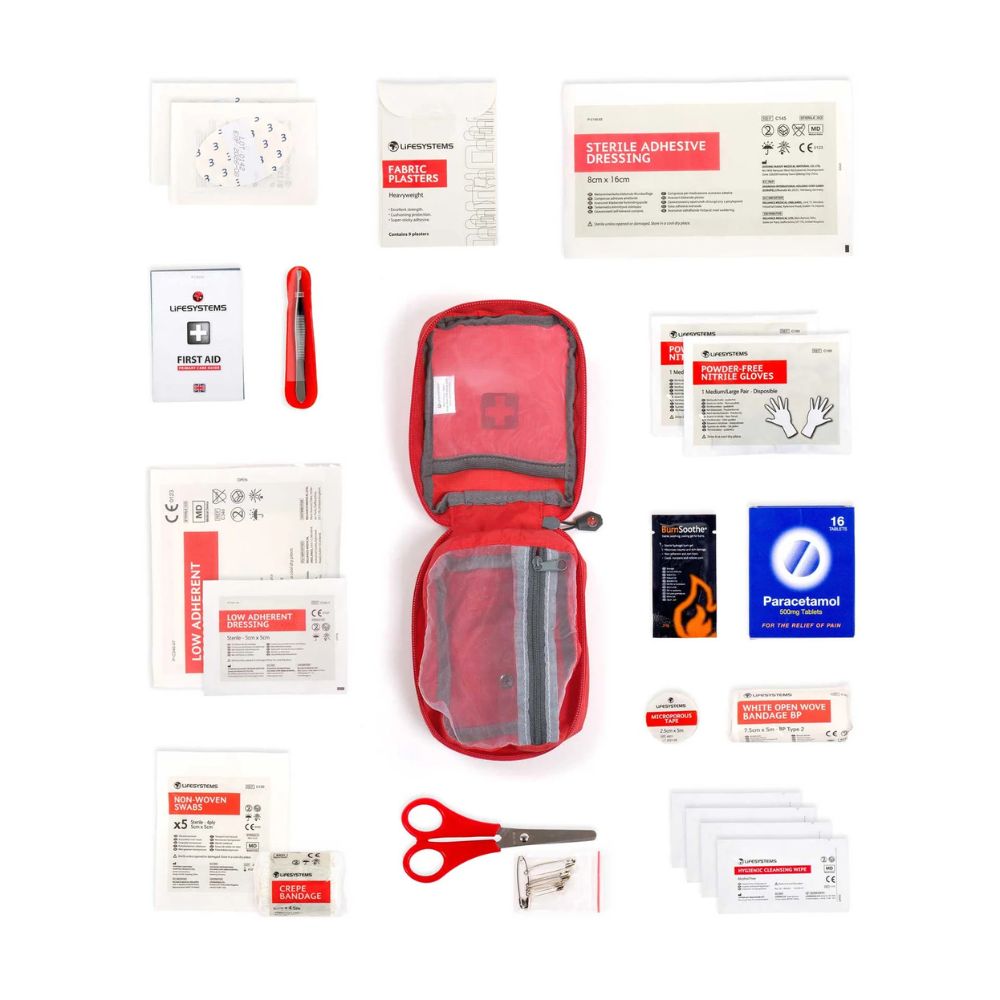 Lifesystems Trek First Aid Kit with various components on a white background