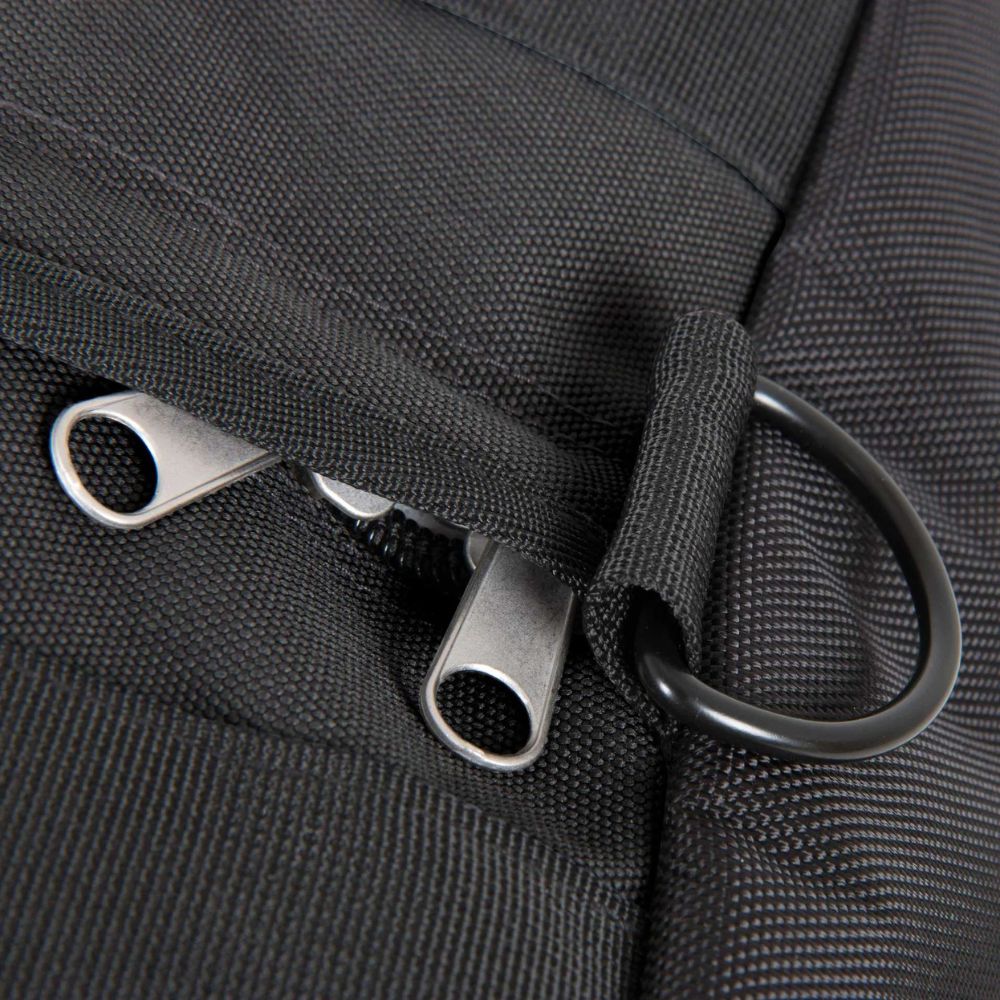 Close-up of a black bag with metal zippers and hooks.