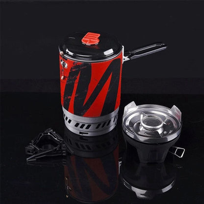 Red and black portable stove with a black background