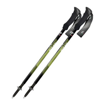 Two green and black hiking poles on a white background