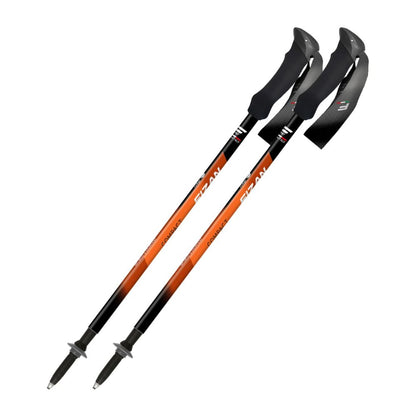 Two orange and black hiking poles on a white background