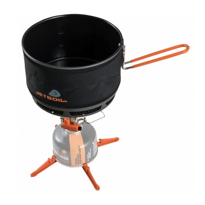 Jetboil stove system with black container and orange accents on a white background