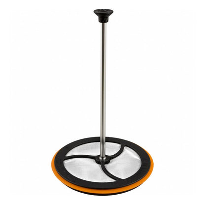 Cleaning tool with a round orange base and black handle on a white background