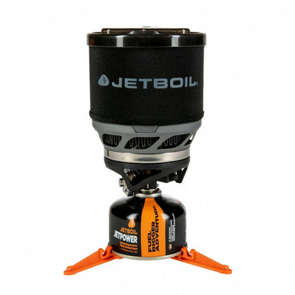 Jetboil stove with black lid and orange legs on a white background