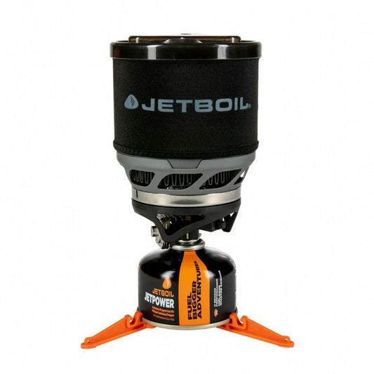 Jetboil stove with black lid and orange legs on a white background