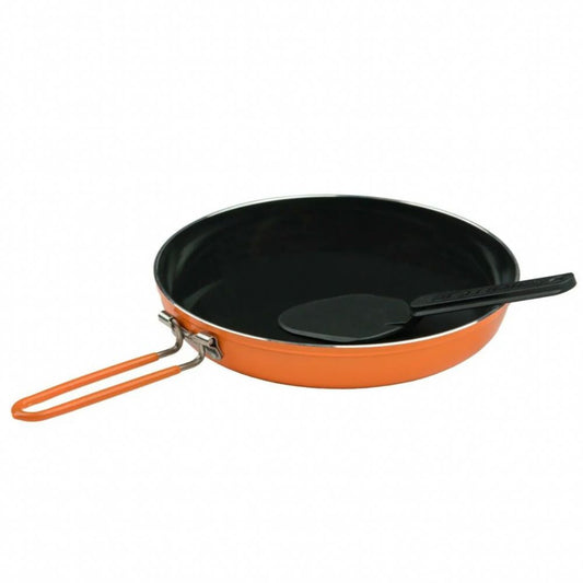 Black frying pan with orange handle and black spatula on a white background