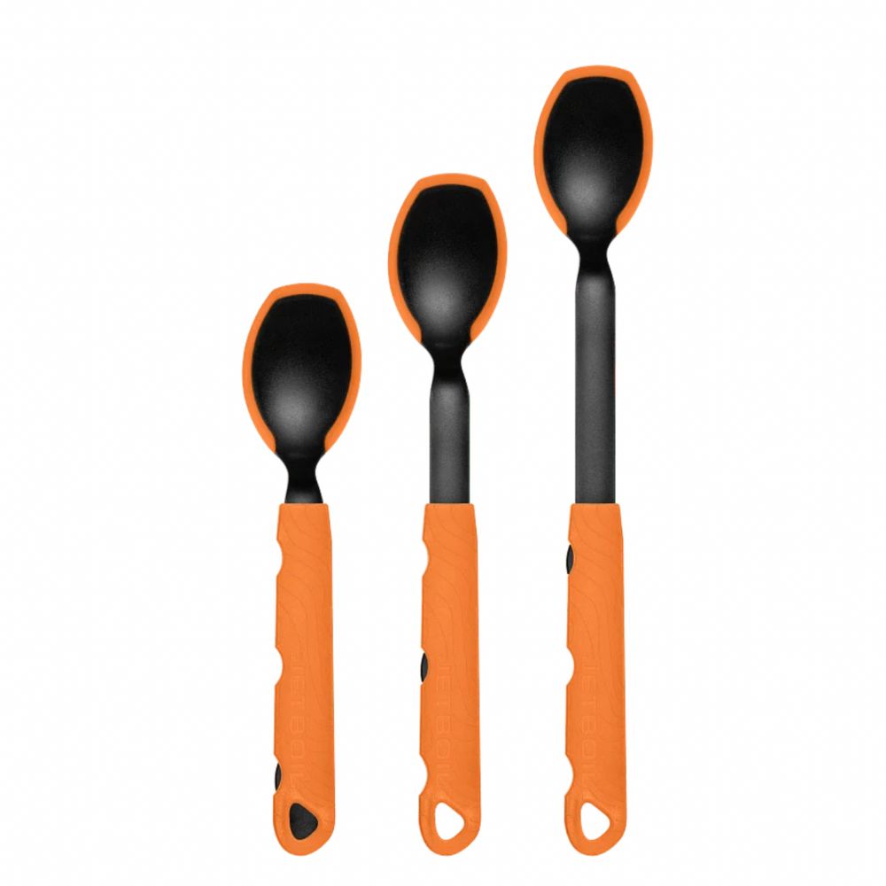 Three black and orange spoons on a white background