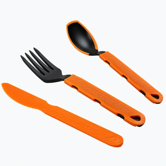 Set of orange camping utensils with black handles on a white background