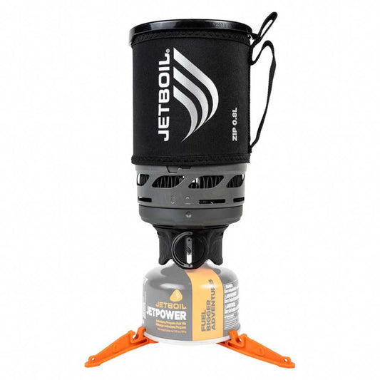 Jetboil cooking system with black lid and orange legs on a white background