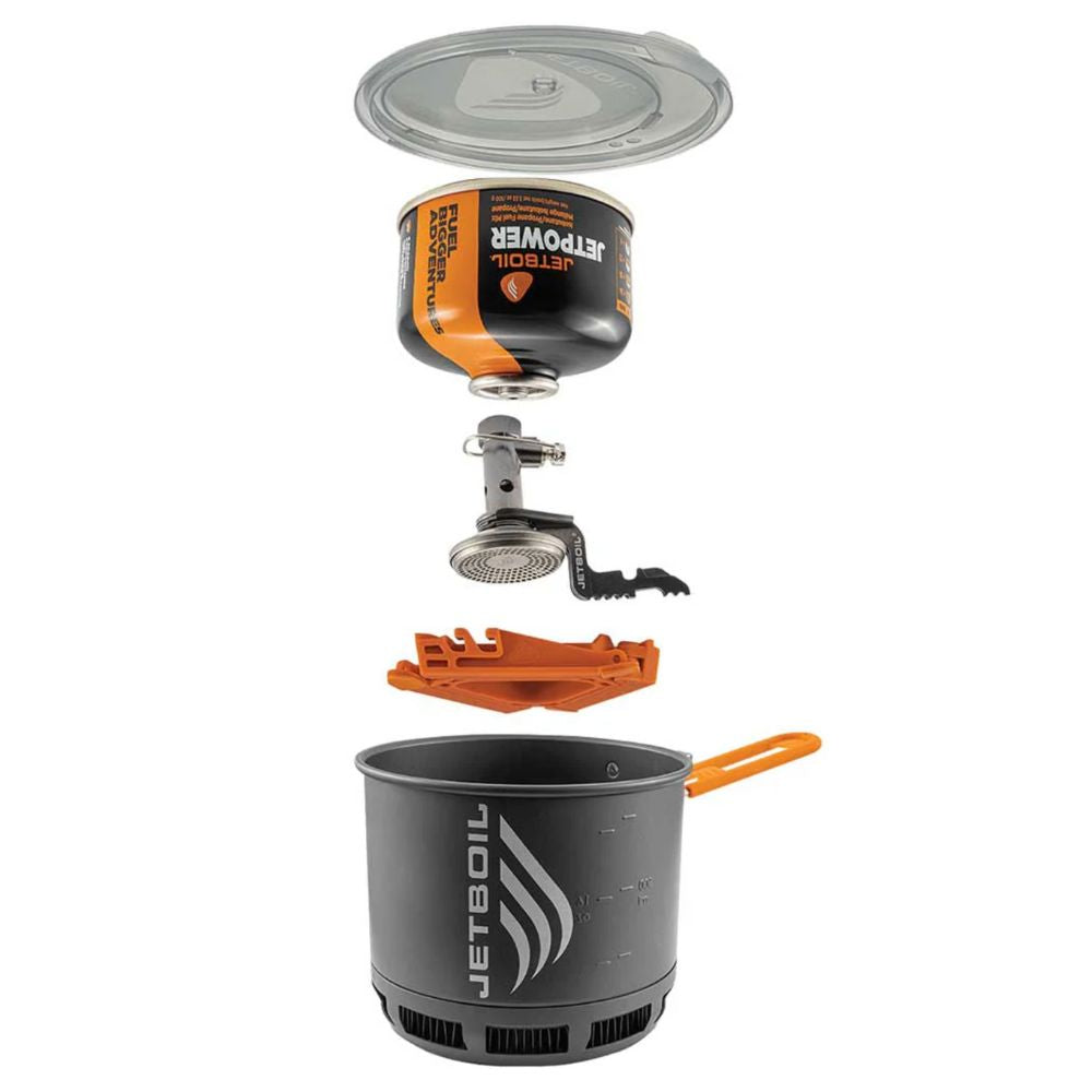 Camping stove with pot and fuel canister on a white background