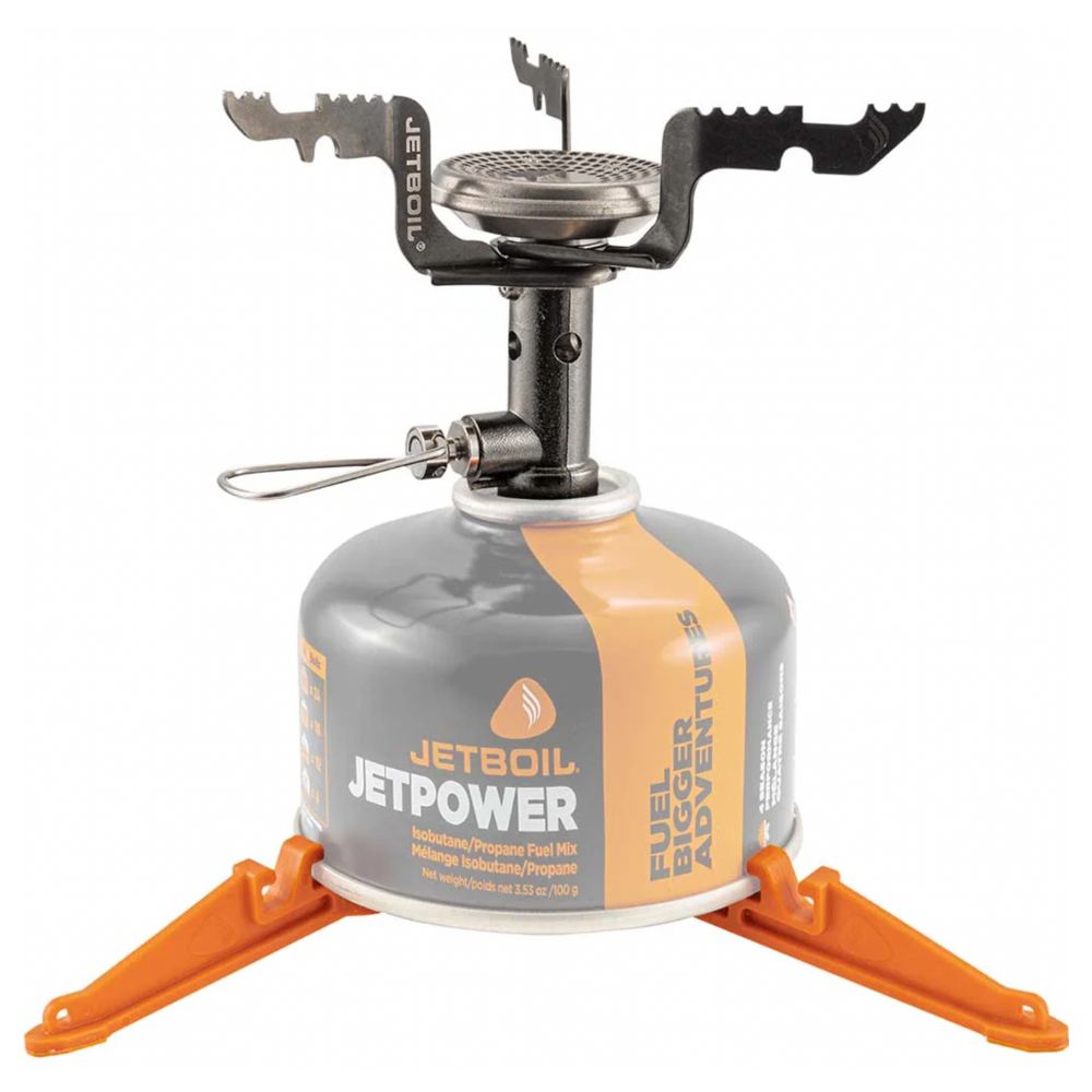 Jetboil stove with orange legs and gray fuel canister on a white background