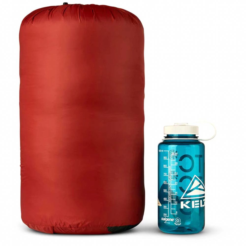 Red compression sack and blue Nalgene water bottle with Klean Kanteen logo on a white background