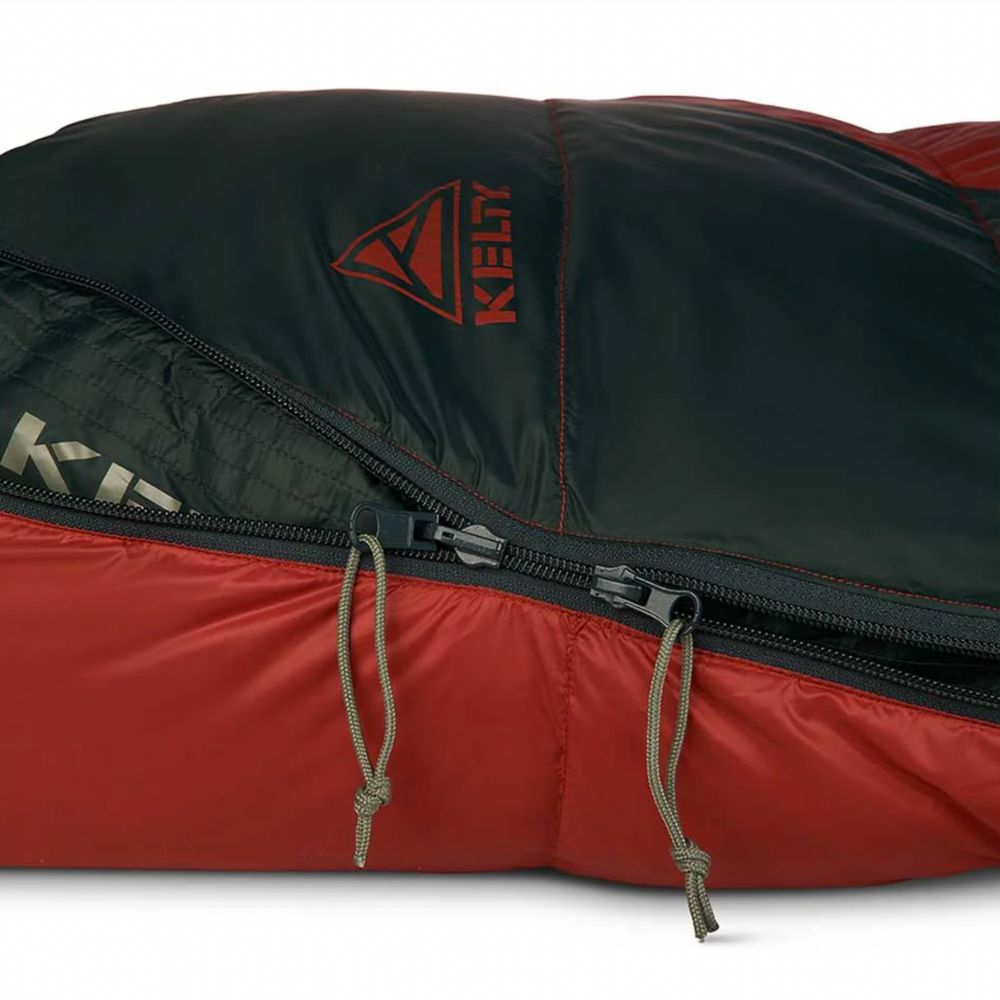 Red and black sleeping bag with Kelty logo on a white background