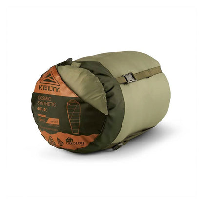 Green sleeping bag with orange label on a white background