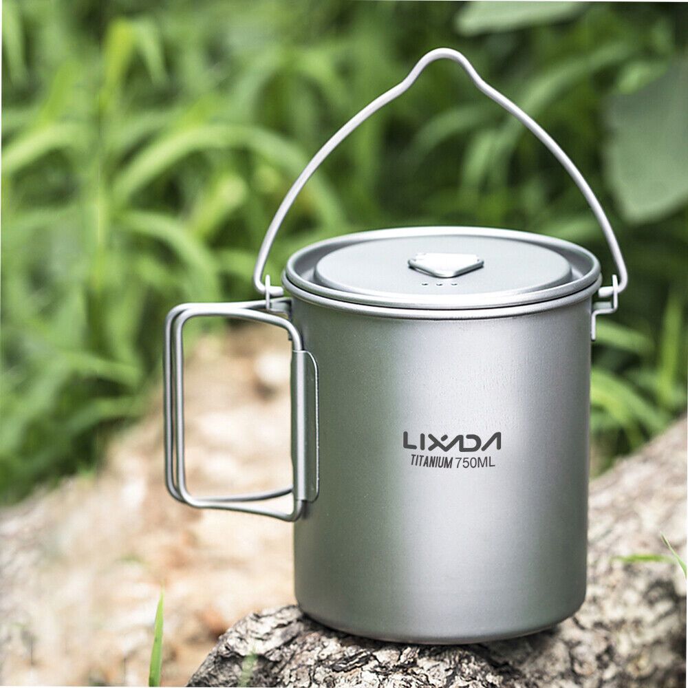 Lixada Lightweight Titanium Camping Cup with Hanging Handle (750ml) in the woods