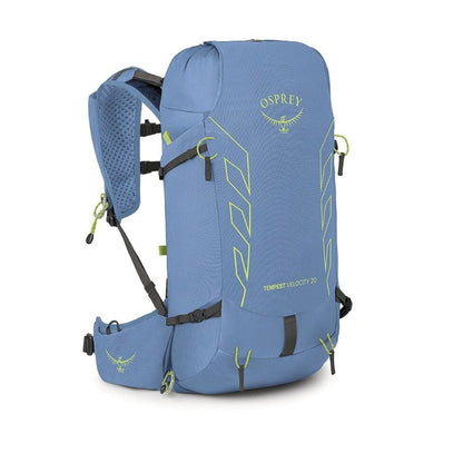 A blue Osprey Transfert Velocity 20 hiking backpack shown from a three-quarter angle on a white background, featuring lime green accents and black straps.