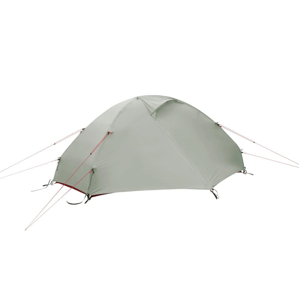 Green camping tent with red accents on a white background