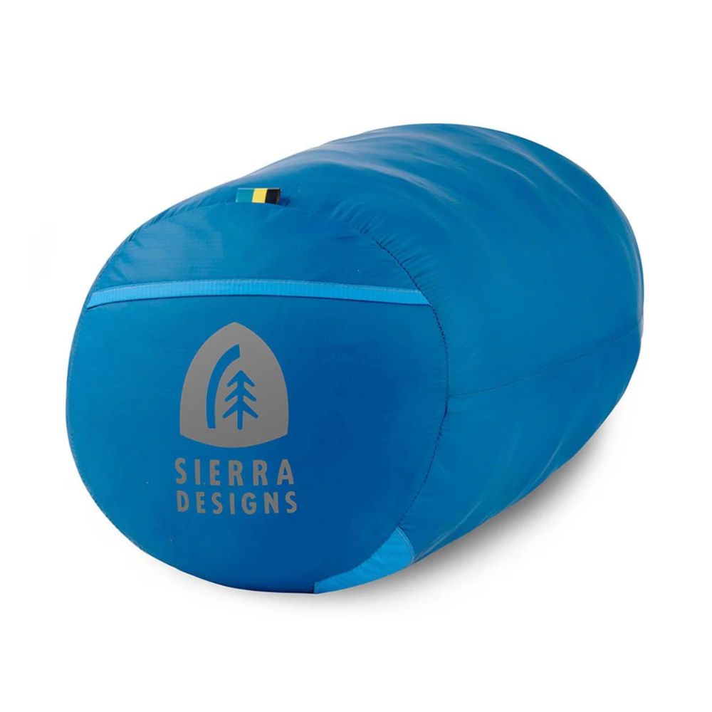 Blue sleeping bag with Sierra Designs logo on a white background