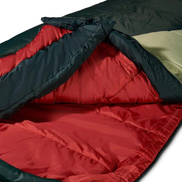 Close-up of a red and black sleeping bag with a white background